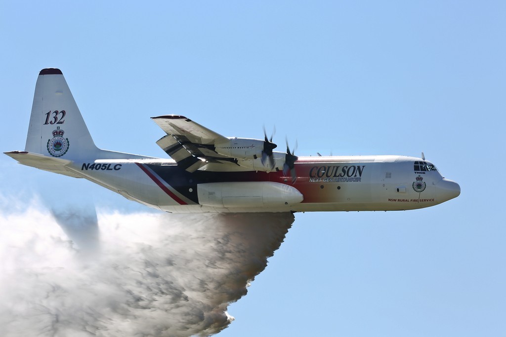 'Thor', a C-130 Hercules contracted to the NSW Government to assist in fighting bushfires dispenses water during a demonstration over the Rickaby's drop zone near RAAF Base Richmond. *** Local Caption *** RAAF Base Richmond will be used to provide airfield support services to Large Air Tanker and Very Large Air Tanker aircraft contracted to the New South Wales (NSW) Government from 01 September 2015 to 20 January 2015, assisting with NSW Rural Fire Service (RFS) efforts to combat bushfires. Defence is providing a number of services including aircraft parking and security, access to fuel and refuelling facilities, equipment storage, use of resources including water, aircrew office space, and meals and accommodation for up to 20 people, as required. Facilitating the aircraft at RAAF Base Richmond is intended to maximise aircraft utility and provide access to all areas of NSW in the event of a bushfire emergency. State and Territory Governments have primary responsibility for the protection of life, property and the environment, and for coordinating and planning an emergency response or recovery within their jurisdictions. Ground-based and aerial bush fire fighting is a highly specialised field that requires equipment and training that, in general, Defence does not possess. RAAF Base Richmond will be used to provide airfield support services to Large Air Tanker and Very Large Air Tanker aircraft contracted to the New South Wales (NSW) Government from 01 September 2015 to 20 January 2016, assisting with NSW Rural Fire Service (RFS) efforts to combat bushfires. Defence is providing a number of services including aircraft parking and security, access to fuel and refuelling facilities, equipment storage, use of resources including water, aircrew office space, and meals and accommodation for up to 20 people, as required. Facilitating the aircraft at RAAF Base Richmond is intended to maximise aircraft utility and provide access to all areas of NSW in the event of a bushfire emergency.