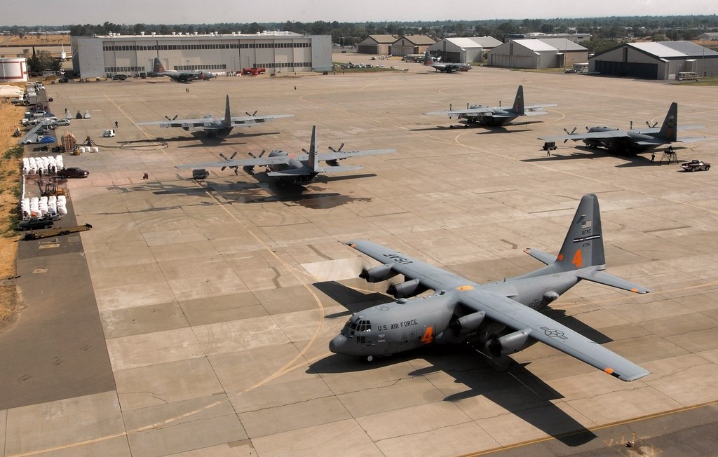 A C-130 Hercules from the Air Force Reserve Command's 302nd Airlift Wing at Peterson Air Force Base, Colo., equipped with the modular airborne firefighting system, taxies to the runway at McClellan Airfield, Calif., July 5 to begin firefighting operations. Aircraft from the 302nd AW are conducting firefighting support missions as part of the 302nd Air Expeditionary Group. (U.S. Air Force photo by Staff Sgt. Hector Garcia)